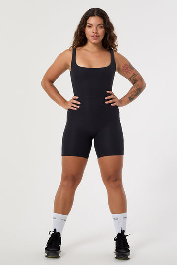 Black onesie with a cute square neckline, low back, high waist seam, and double side pockets. Perfect for every activity