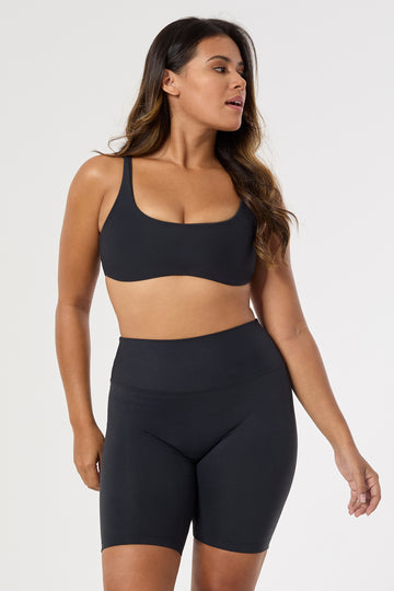 Mid-high waisted black shorts with a V-shaped back seam for a flattering lift. Squat proof, no front seam, and double-layered waistband