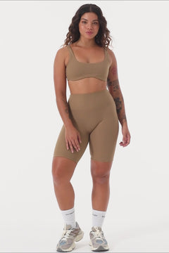 Light brown two in one reversible sports bra, medium-impact support with seamless fit, under-bust support, and removable padding