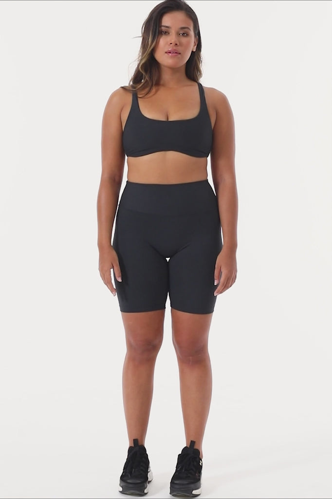 Mid-high waisted black shorts with a V-shaped back seam for a flattering lift. Squat proof, no front seam, and double-layered waistband