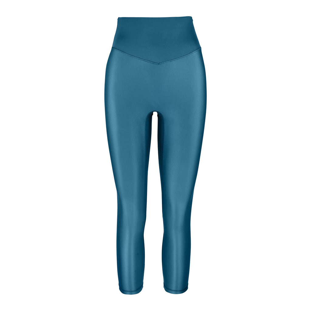 Versatile mid blue 7/8 compressive leggings that fit like a glove and stay put during workouts. Squat proof and no front seam for ultimate comfort, ghost image front view