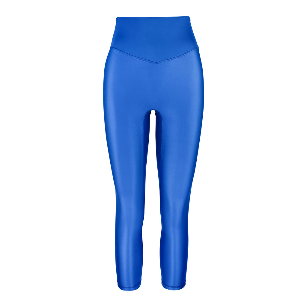 Versatile clear blue 7/8 compressive leggings that fit like a glove and stay put during workouts. Squat proof and no front seam for ultimate comfort, ghost image front view