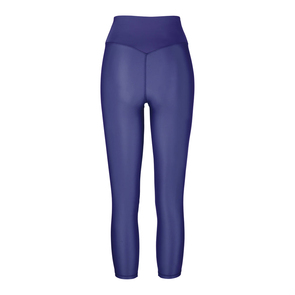 Versatile royal blue 7/8 compressive leggings that fit like a glove and stay put during workouts. Squat proof and no front seam for ultimate comfort, ghost image back view