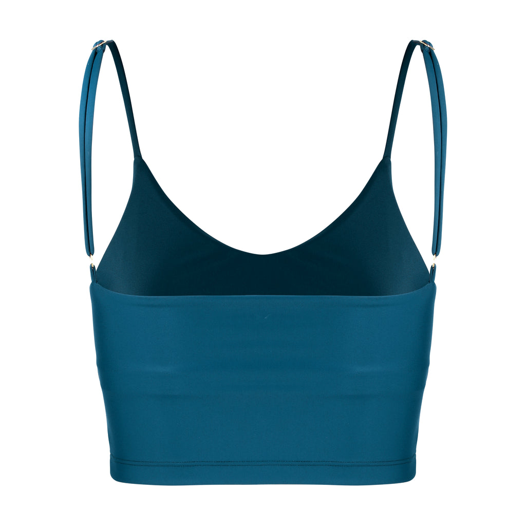 Mid blue crop top with inbuilt bra for low-impact activities, seamless fit, removable padding, and adjustable straps. Comfortable for work or on the go, ghost image front view