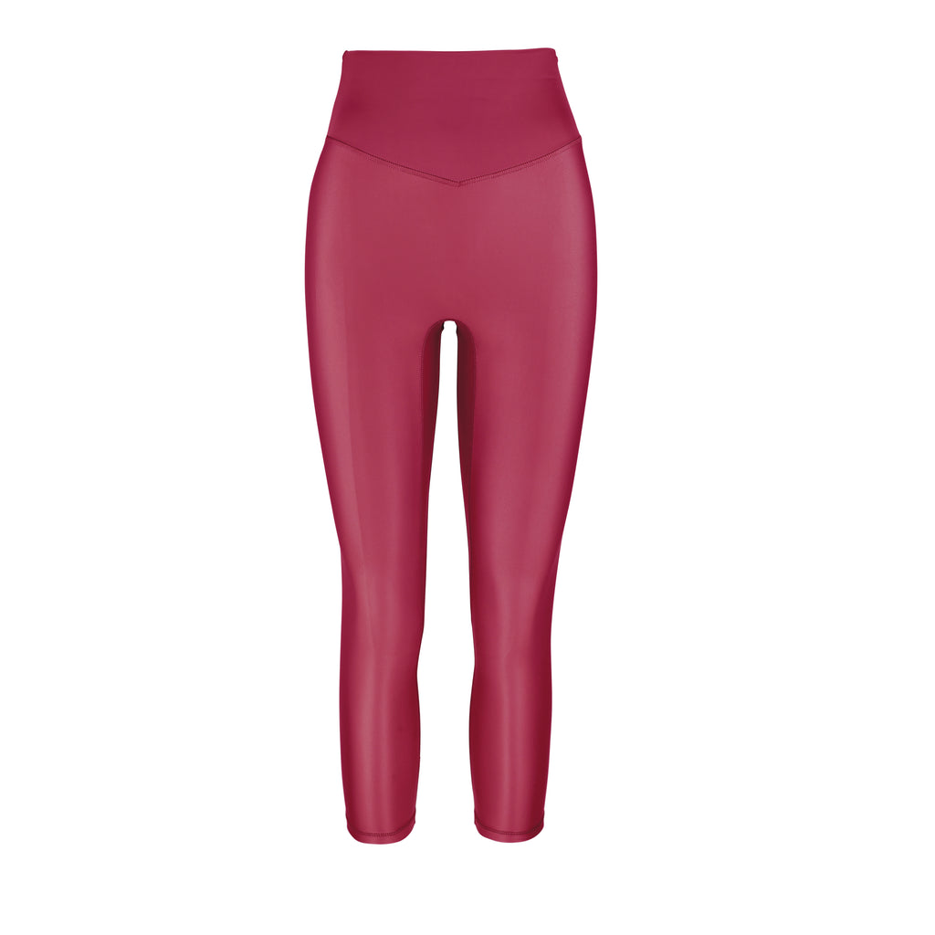 Versatile dark red 7/8 compressive leggings that fit like a glove and stay put during workouts. Squat proof and no front seam for ultimate comfort, ghost image front view