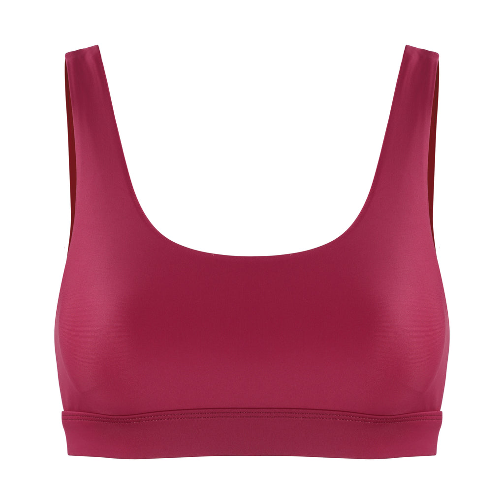 Dark red classic sports bra with mid to high impact support, seamless fit that holds everything in place, removable padding, ghost image front view