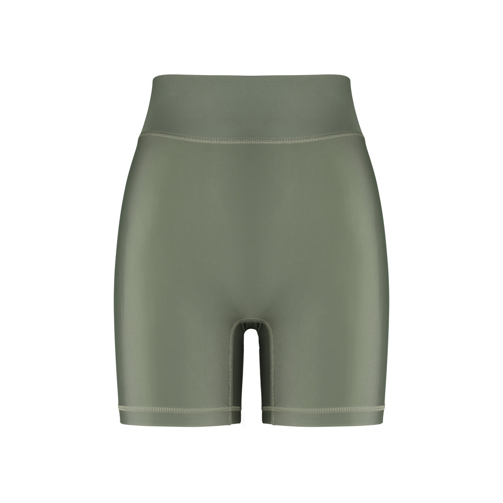 High-waisted olive green bicycle shorts with a secure, compressive fit. No front seam and flattering wide waist band, ghost image front view