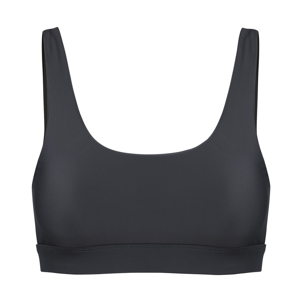 Black classic sports bra with mid to high impact support, seamless fit, removable padding, ghost image, front view