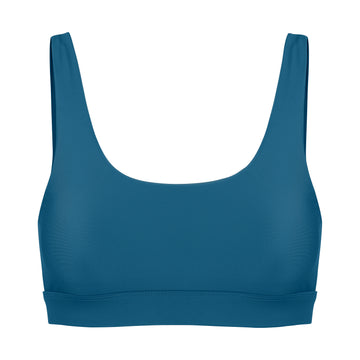 Blue classic sports bra with low to high impact support with seamless fit and removable padding, ghost image front view.