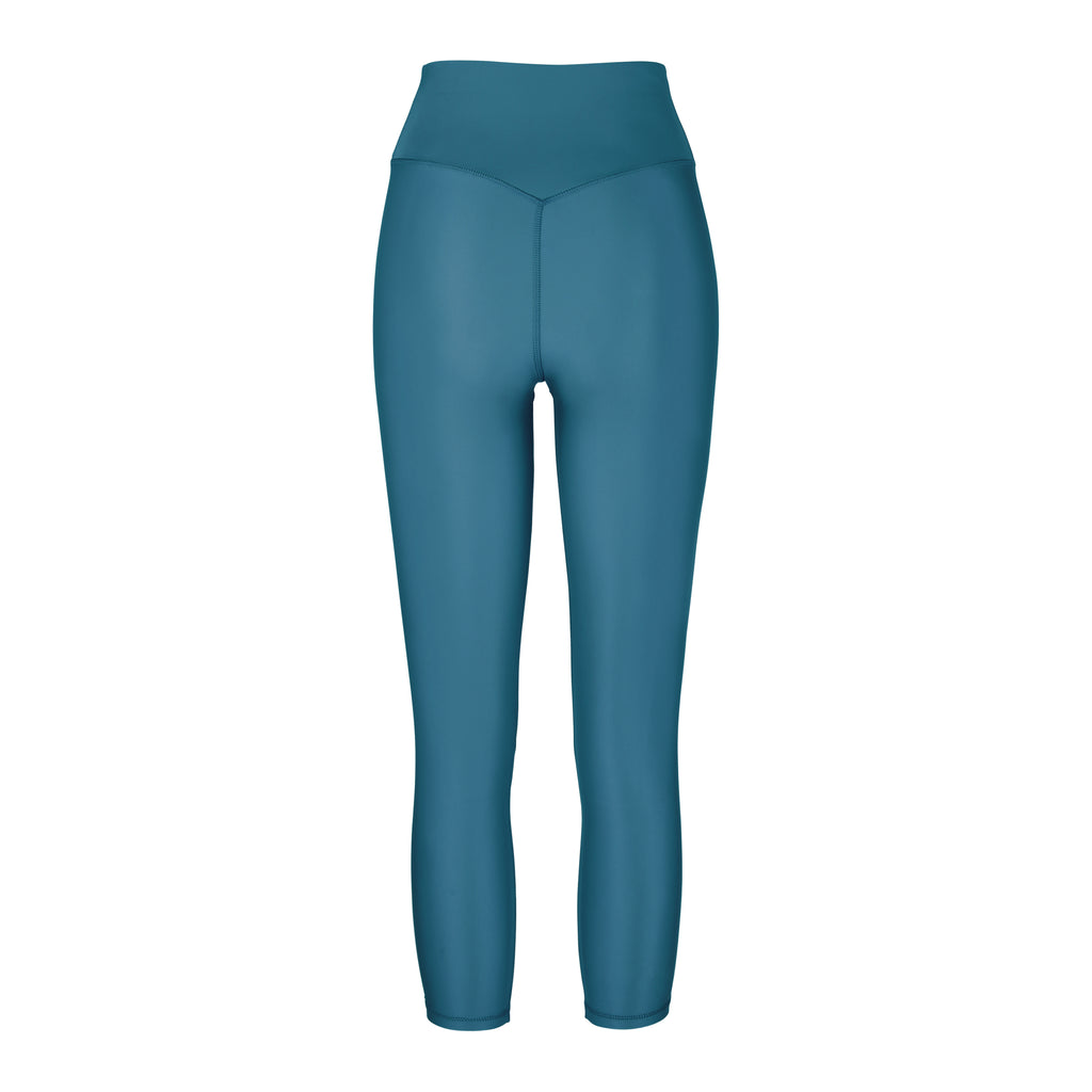 Versatile mid blue 7/8 compressive leggings that fit like a glove and stay put during workouts. Squat proof and no front seam for ultimate comfort, ghost image back view