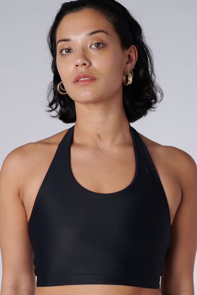 Low-impact black seamless fit with removable padding and in-built sports bra for comfort and support close up