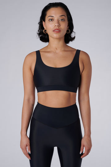 Black classic sports bra with mid to high impact support, seamless fit, removable padding, 