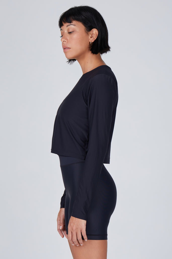 Ultra-lightweight, quick-drying long sleeve black crop top that fits like a second skin for comfort and UV protection side view