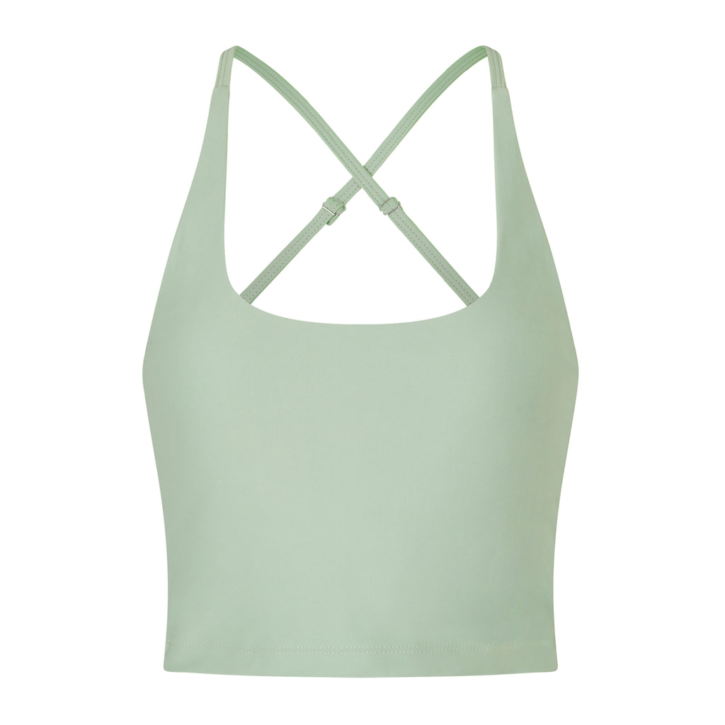 Light green seamless crop top with cross back adjustable straps, in-built sports bra, and removable padding, ghost image, front view