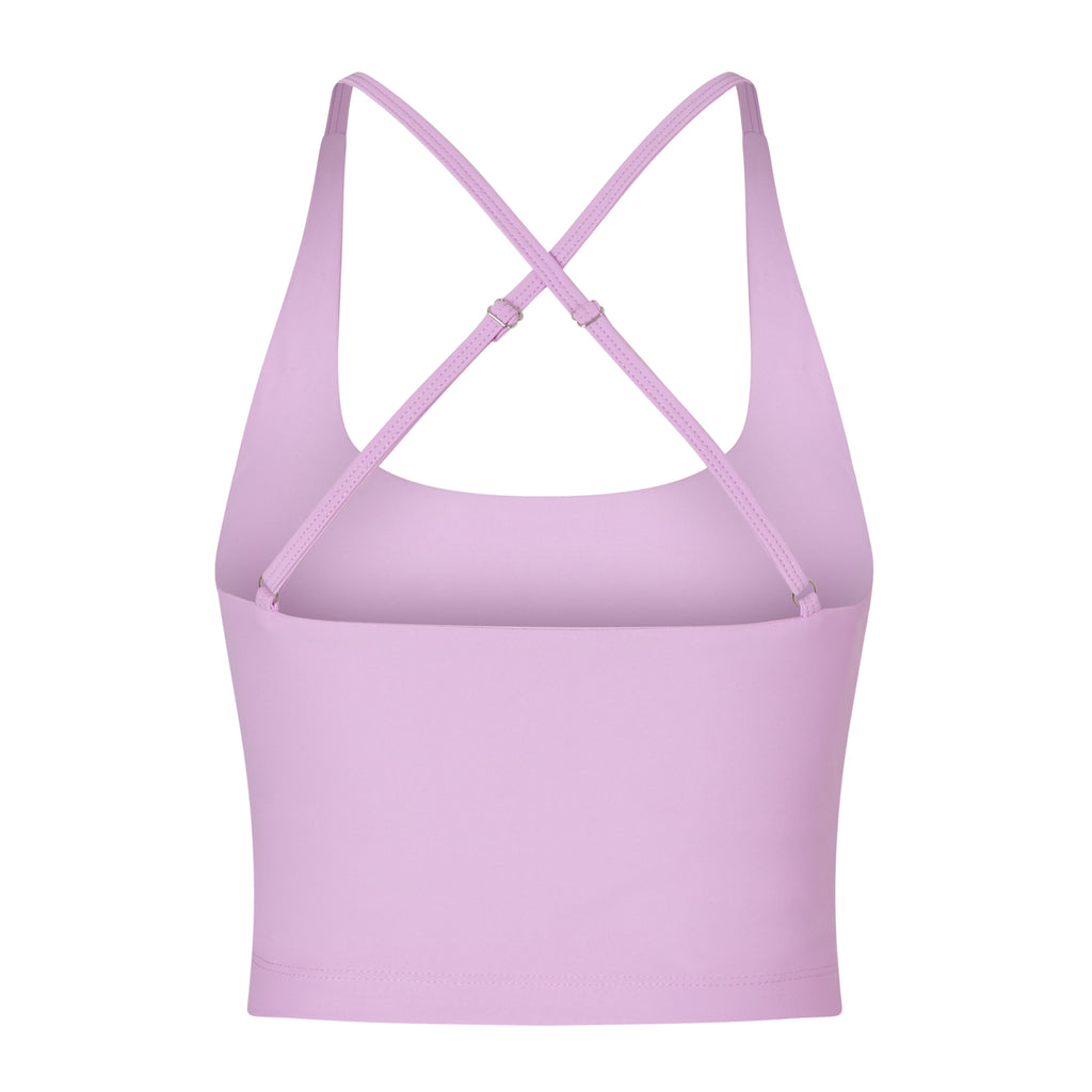 Light pink seamless crop top with cross back adjustable straps, in-built sports bra, and removable padding , ghost image back view