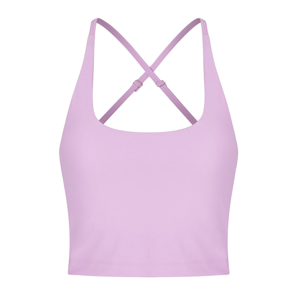 Light pink seamless crop top with cross back adjustable straps, in-built sports bra, and removable padding , ghost image front view