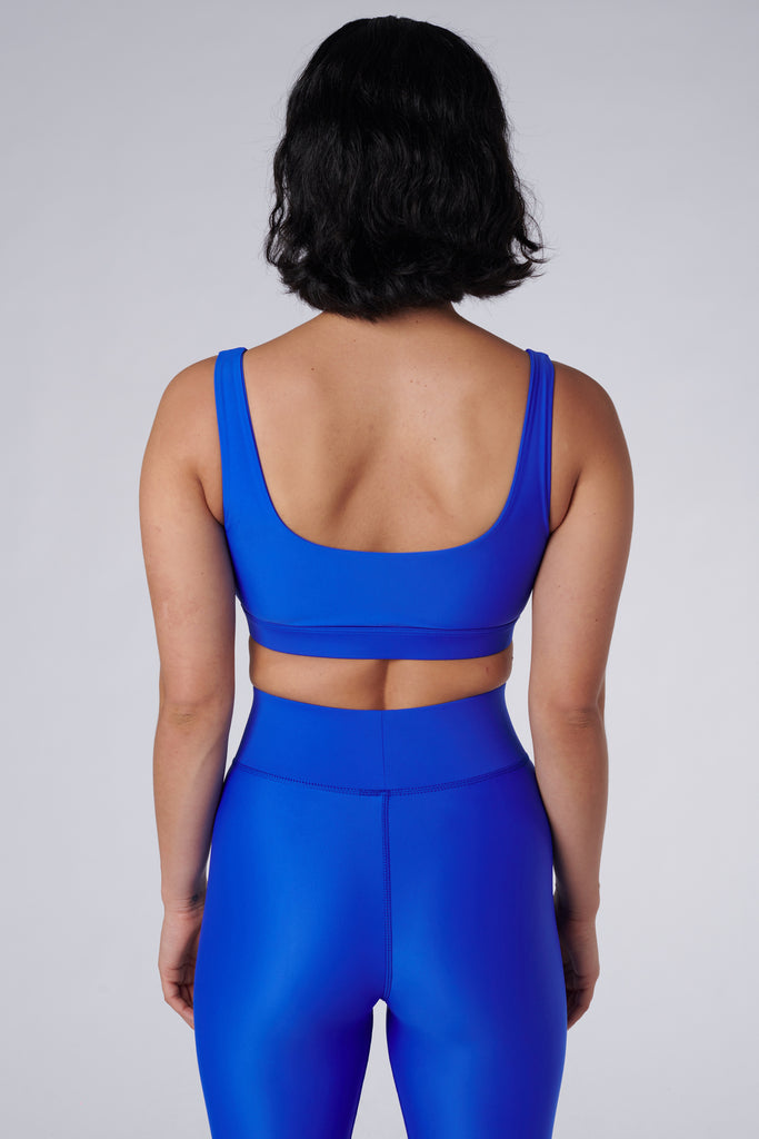 Blue classic sports bra with mid to high impact support, seamless fit, removable padding, back view