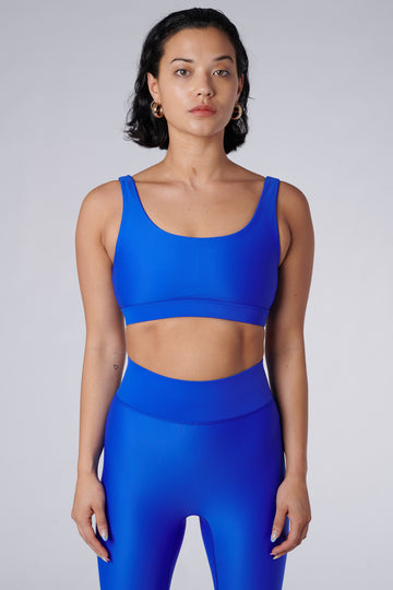 Blue classic sports bra with mid to high impact support, seamless fit, removable padding, 