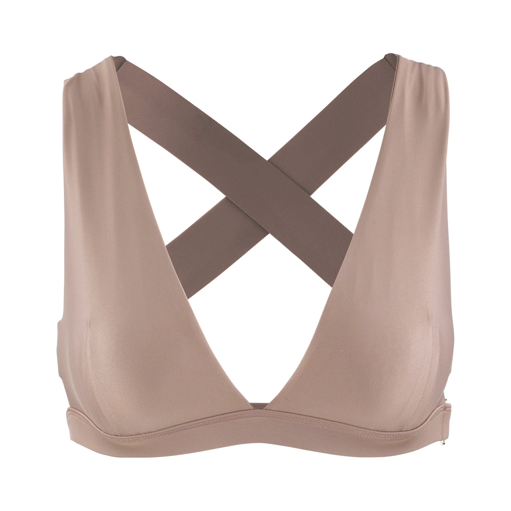 Beige, medium to high impact support with removable padding, strong elastic cross back straps, and adjustable gold-hook closure, ghost image front view