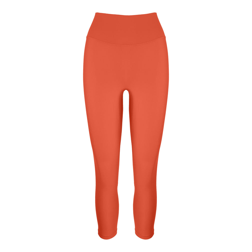 Super soft orange high-waisted 7/8 leggings without a front seam for all-day comfort. Perfect for non abrasive sports and everyday wear, ghost image front view