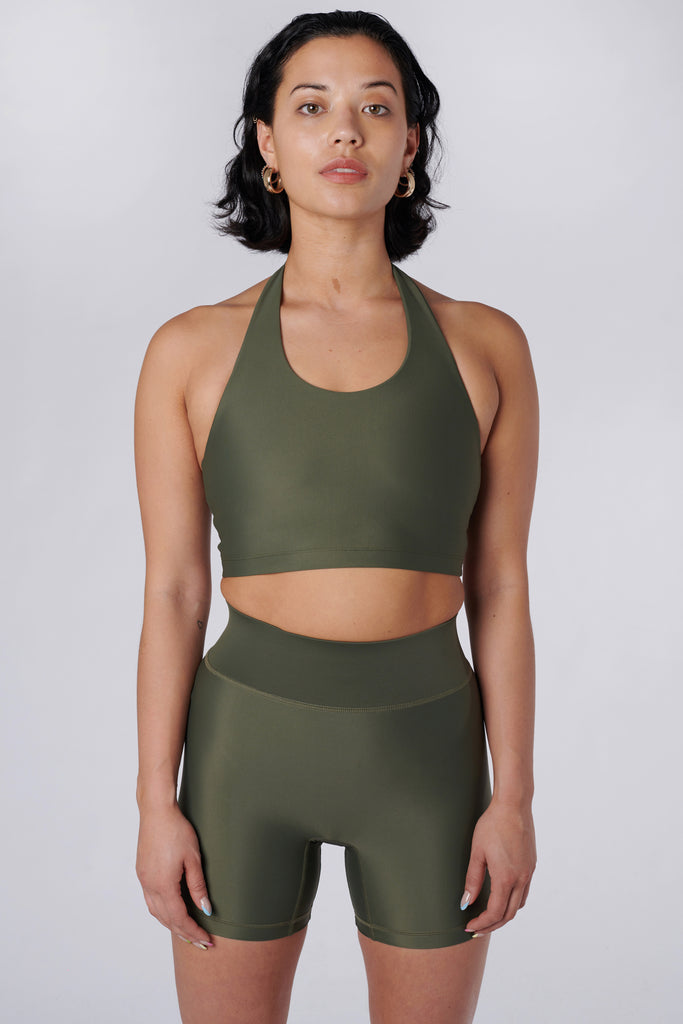 Low-impact olive green seamless fit with removable padding and in-built sports bra for comfort and support front view