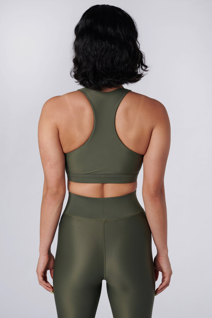 Easy to wear front zipped olive green crop top with low-impact support, removable padding and in-built sports bra, back view