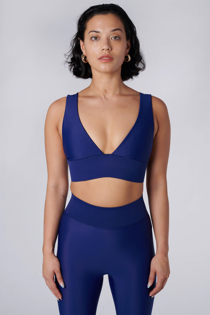 Classy and sexy sports bra in royal blue with low-impact support, seamless fit, removable padding, and a wide under-bust elastic band  front view