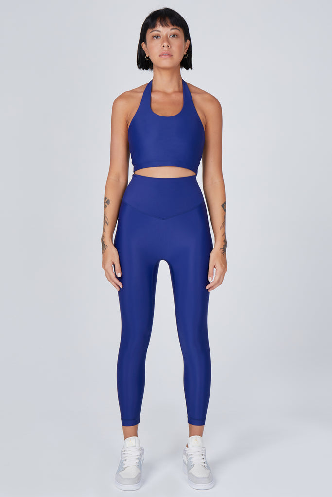 Versatile royal blue 7/8 compressive leggings that fit like a glove and stay put during workouts. Squat proof and no front seam for ultimate comfort, front view