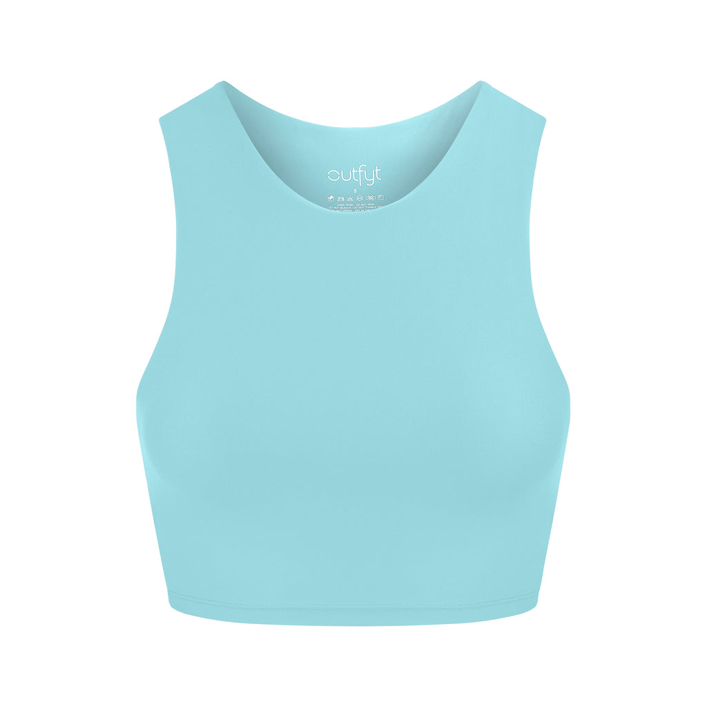 Award-winning ice blue crop top with a flattering cut, high neckline for coverage, and in-built sports bra. Medium impact support, perfect for day wear, ghost image front view