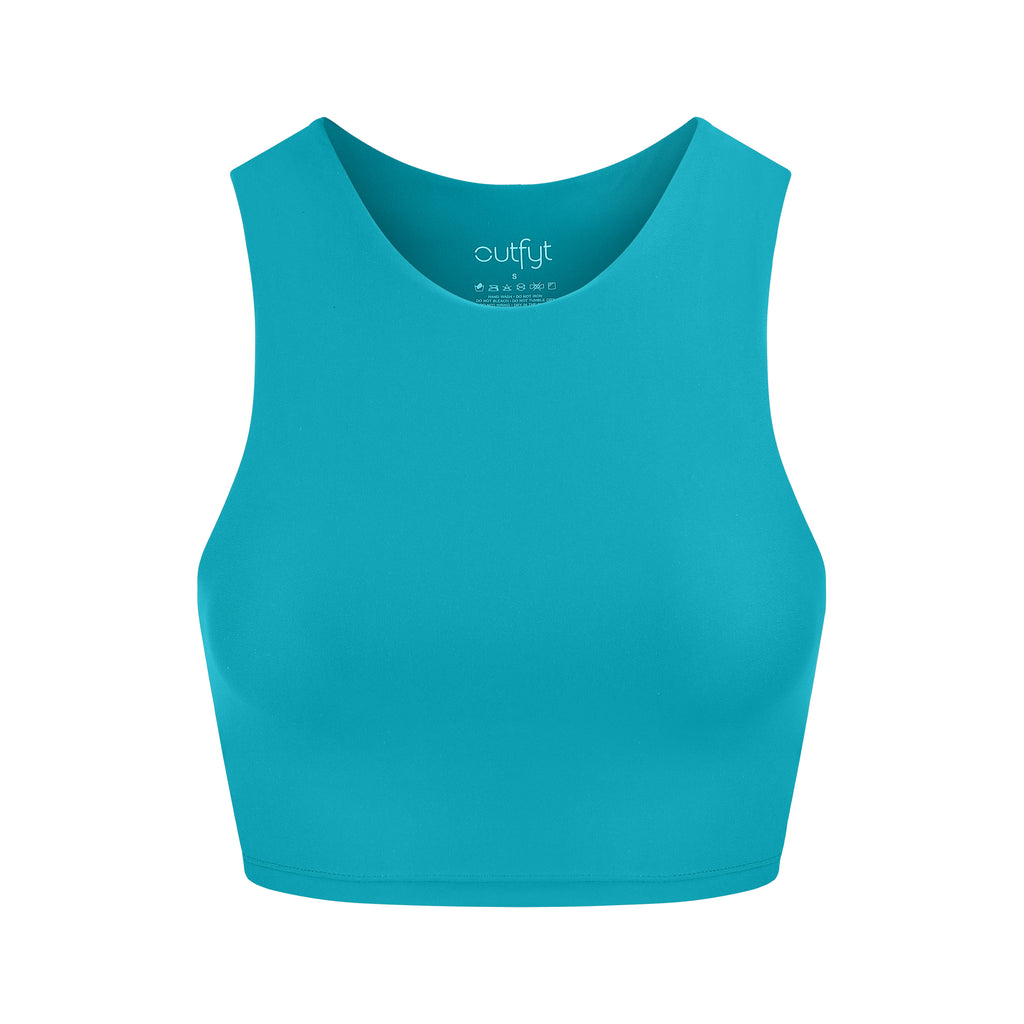 Award-winning blue crop top with a flattering cut, high neckline for coverage, and in-built sports bra. Medium impact support, perfect for day wear, ghost image front view