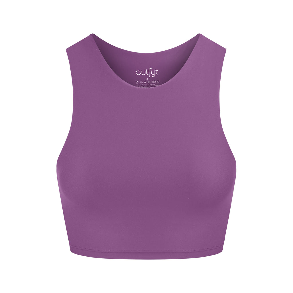 Award-winning purple crop top with a flattering cut, high neckline for coverage, and in-built sports bra. Medium impact support, perfect for day wear, ghost image front view